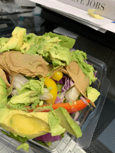Salad with avocado and veggie turkey slices