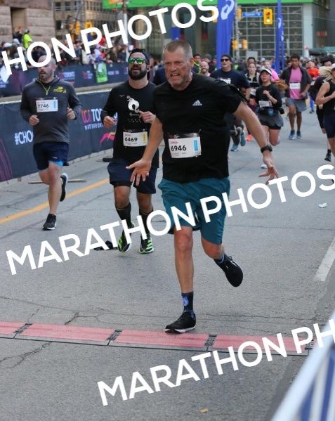 Crossing the finish line at the Toronto Waterfront Half Marathon