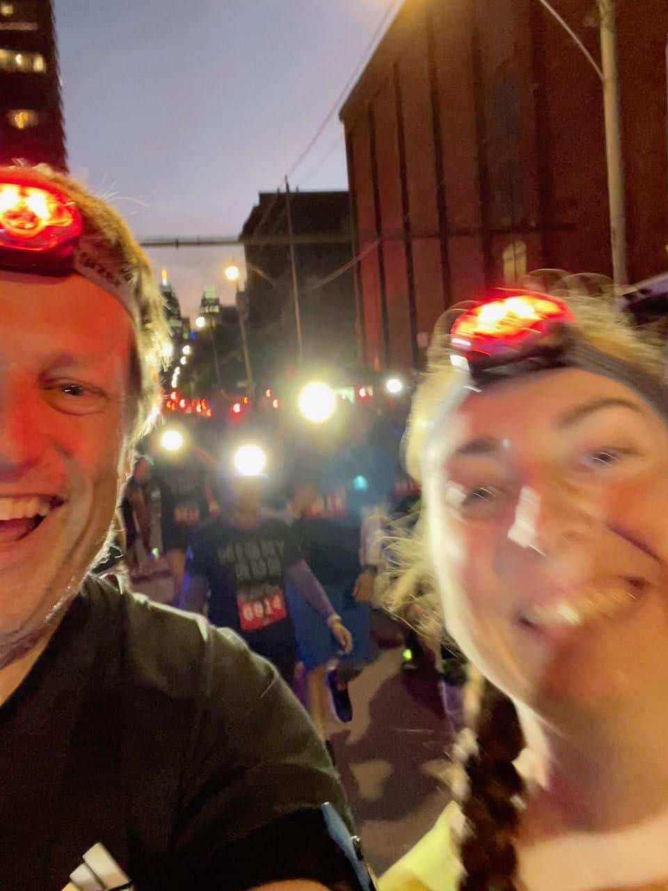 Simon and T running through the start line of the Michelob Ultra Night Run in Toronto